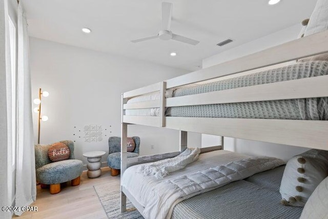 bedroom featuring ceiling fan and light hardwood / wood-style flooring