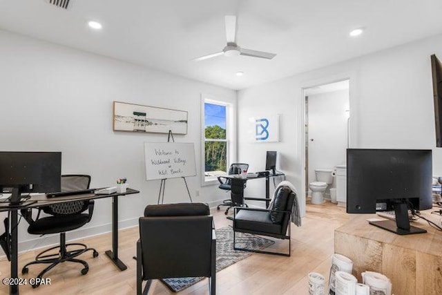 office space featuring ceiling fan and light hardwood / wood-style flooring