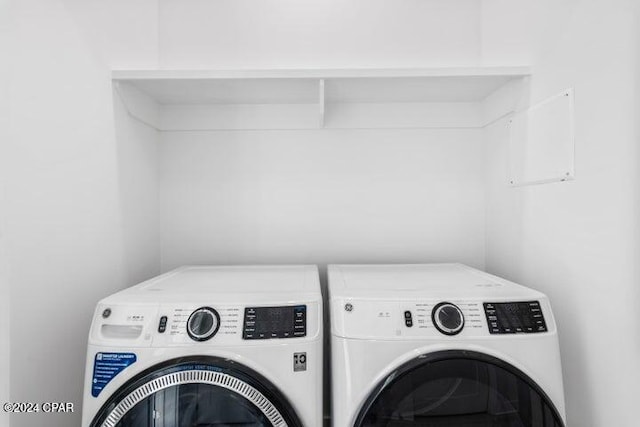 clothes washing area featuring independent washer and dryer