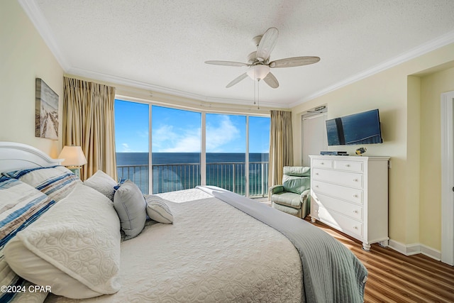 bedroom featuring access to outside, ceiling fan, ornamental molding, and hardwood / wood-style flooring