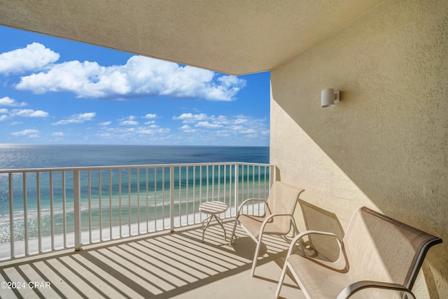 balcony with a view of the beach and a water view