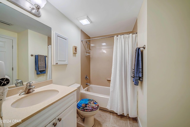 full bathroom with tile patterned flooring, vanity, toilet, and shower / tub combo