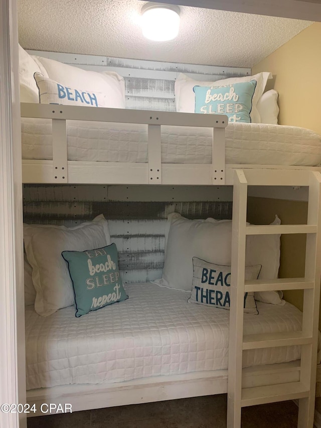 unfurnished bedroom with a textured ceiling