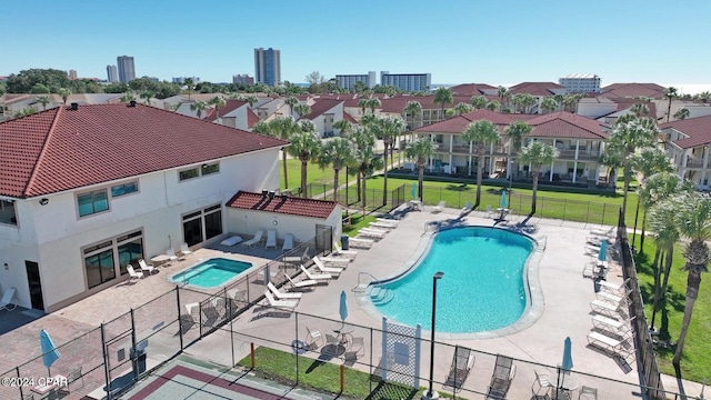 view of swimming pool with a patio area and a yard