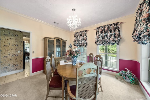 dining space with a chandelier, light colored carpet, and ornamental molding