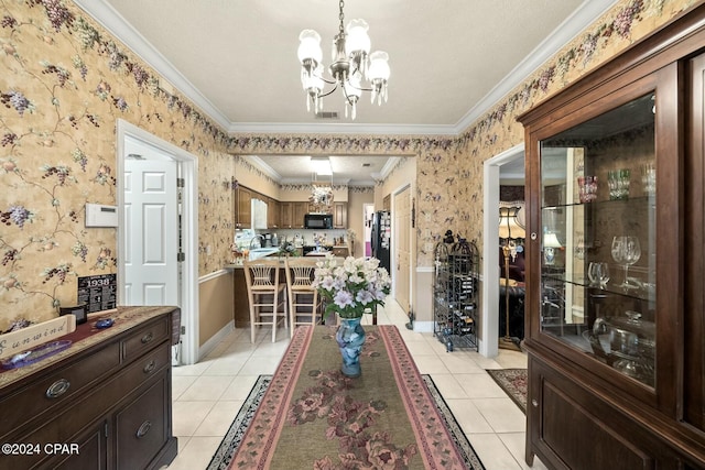 dining space with light tile patterned flooring, a chandelier, a textured ceiling, and ornamental molding