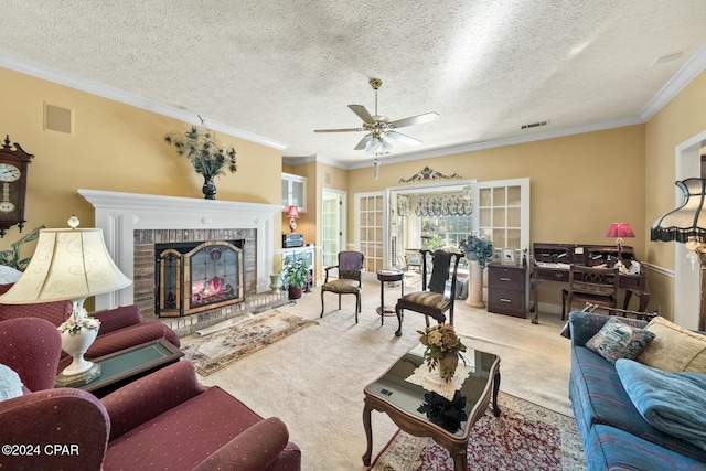 living room with crown molding, light colored carpet, a textured ceiling, and a brick fireplace