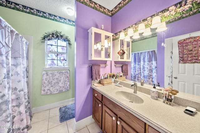 bathroom with tile patterned flooring, vanity, a textured ceiling, and a shower with shower curtain