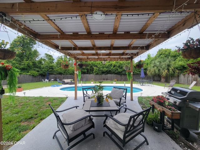 view of patio / terrace with a fenced in pool