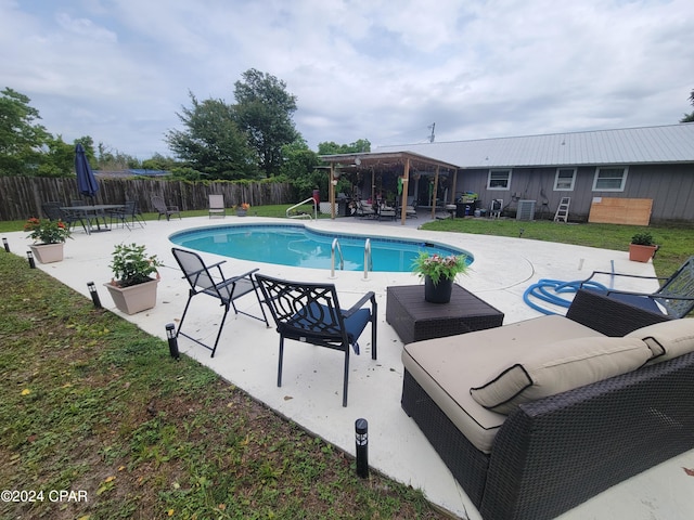 view of swimming pool with outdoor lounge area and a patio