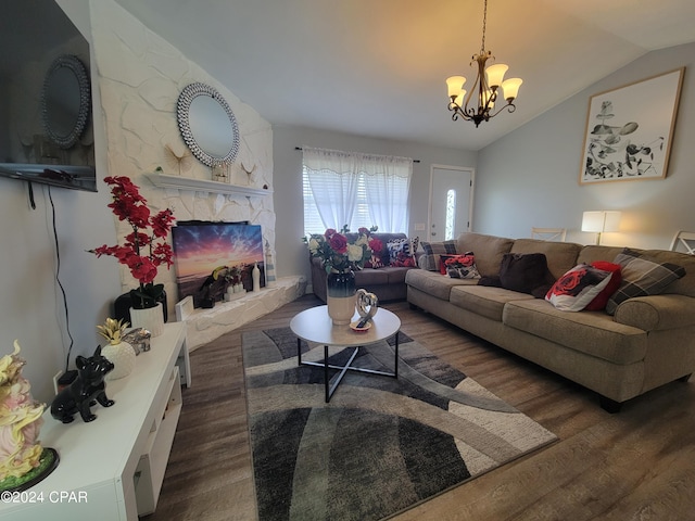 living room with a notable chandelier, lofted ceiling, and dark wood-type flooring