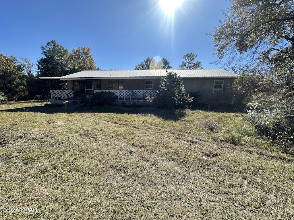 rear view of house with covered porch