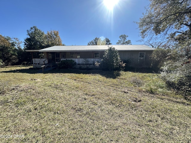 rear view of house with covered porch