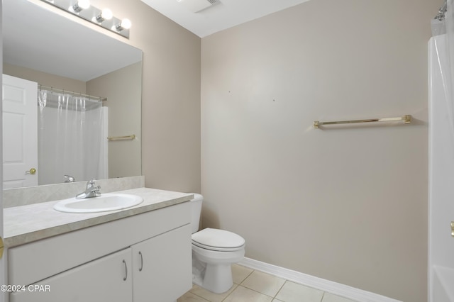 bathroom featuring tile patterned floors, vanity, a shower with shower curtain, and toilet