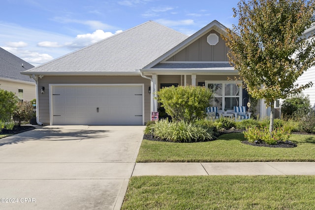 view of front of house with a garage and a front yard