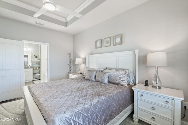 carpeted bedroom with ceiling fan and ornamental molding