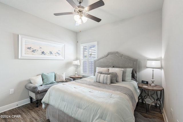 bedroom with ceiling fan and dark hardwood / wood-style flooring