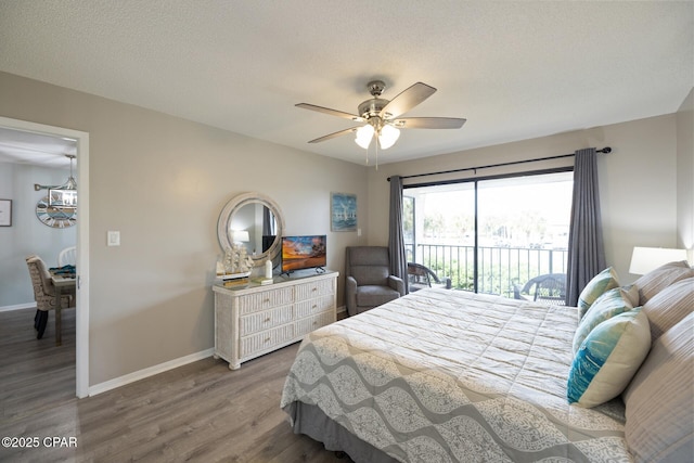 bedroom featuring wood-type flooring, access to outside, ceiling fan, and a textured ceiling