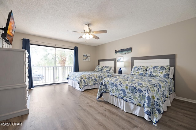 bedroom with access to exterior, hardwood / wood-style floors, a textured ceiling, and ceiling fan