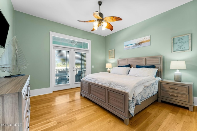 bedroom featuring access to exterior, french doors, light wood-type flooring, and ceiling fan