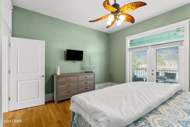 bedroom with access to exterior, ceiling fan, french doors, and light hardwood / wood-style floors