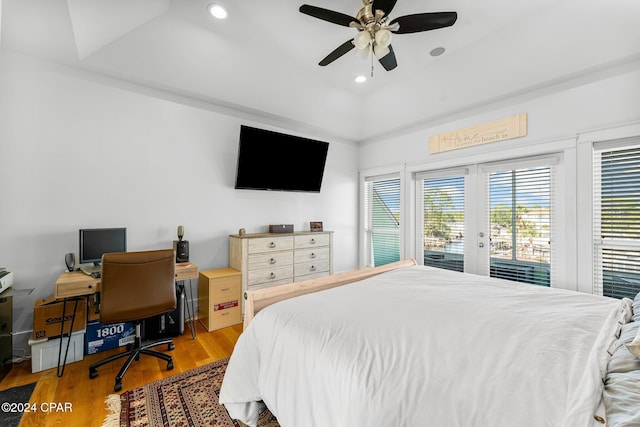 bedroom with hardwood / wood-style floors, ceiling fan, access to outside, and multiple windows