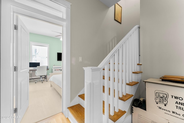 stairs featuring wood-type flooring