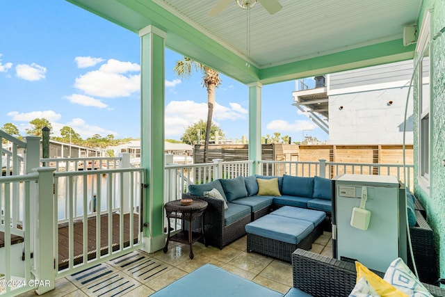 balcony with an outdoor hangout area and ceiling fan