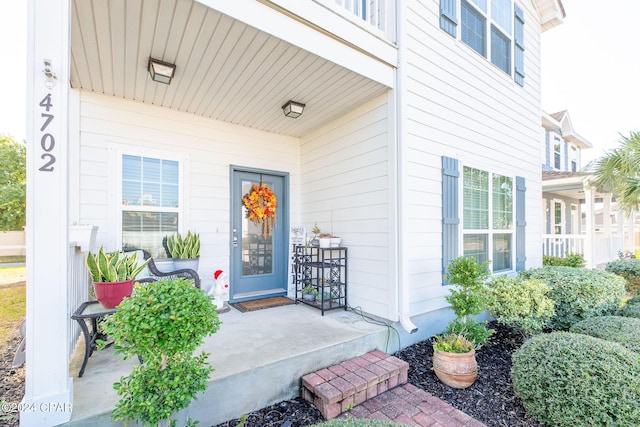 doorway to property featuring a porch