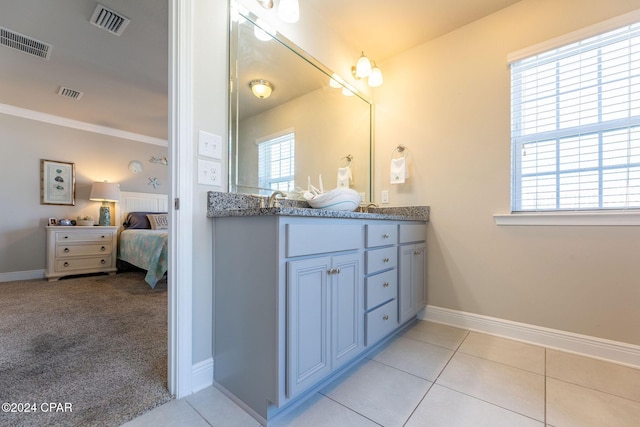 bathroom featuring plenty of natural light, ensuite bath, and visible vents
