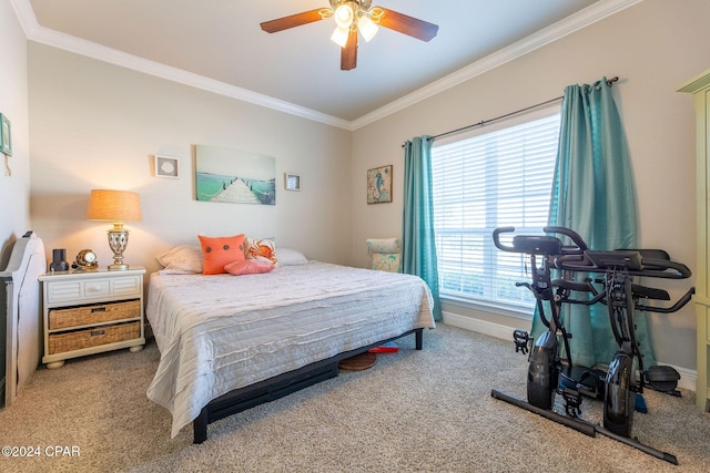 bedroom featuring crown molding, baseboards, ceiling fan, and carpet flooring