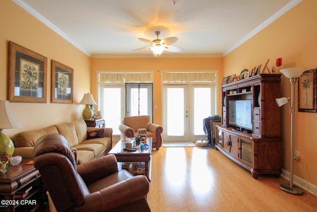 living room featuring ceiling fan, light hardwood / wood-style floors, crown molding, and french doors