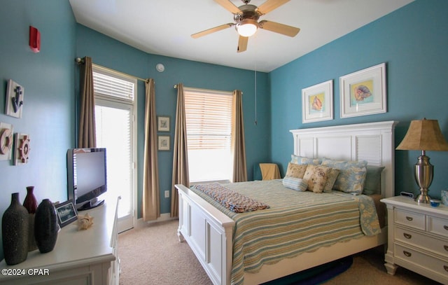 bedroom featuring ceiling fan and light carpet