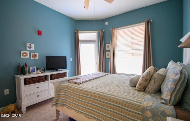 bedroom with light carpet and ceiling fan