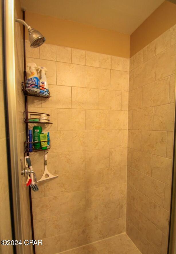 bathroom with tiled shower