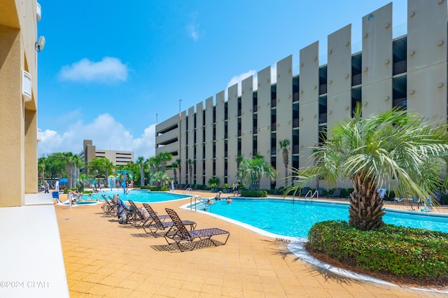 view of swimming pool featuring a patio area