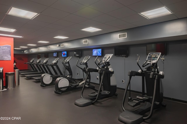 workout area with a paneled ceiling