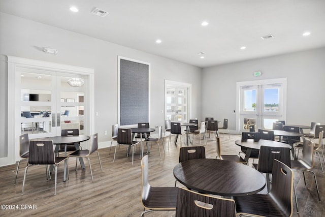 dining area featuring french doors and hardwood / wood-style flooring