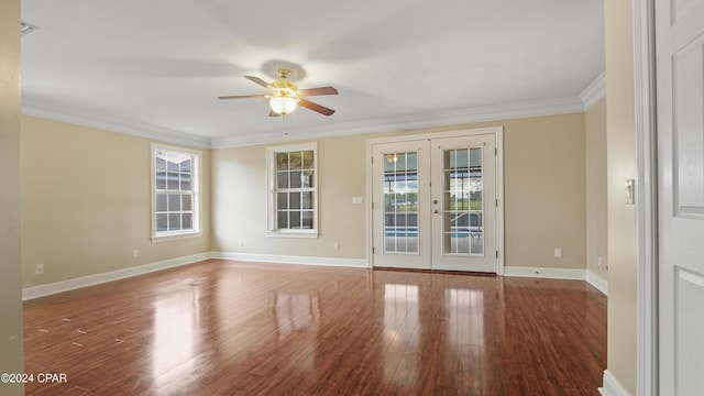 spare room with ceiling fan, hardwood / wood-style flooring, ornamental molding, and french doors