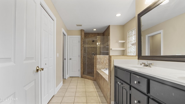 bathroom featuring tile patterned flooring, separate shower and tub, and vanity