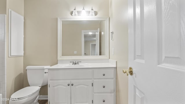 bathroom with toilet and vanity