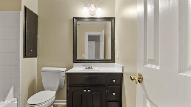 bathroom featuring toilet and vanity