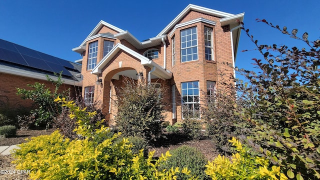 view of front of property with solar panels