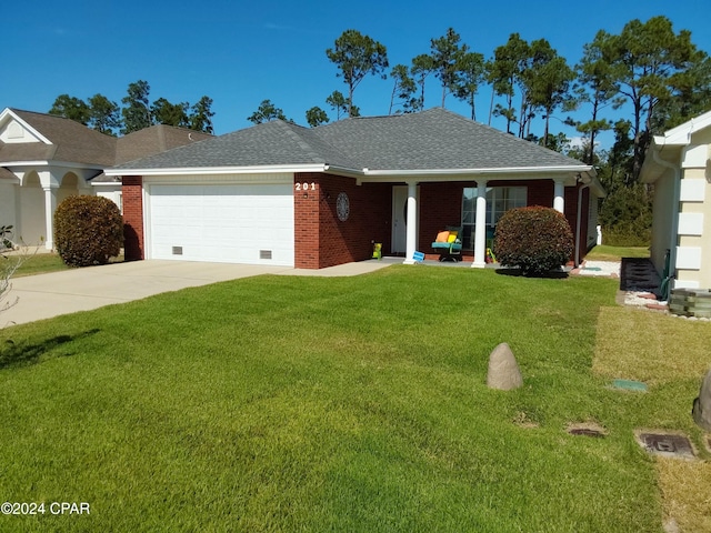 ranch-style house featuring a garage and a front lawn