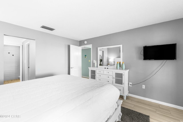 bedroom with light wood-type flooring