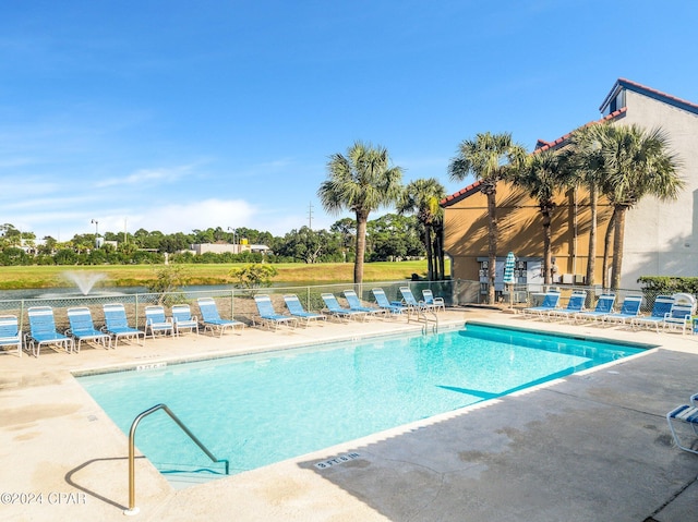 view of swimming pool with a patio