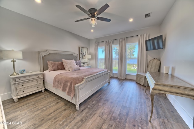 bedroom featuring ceiling fan and dark wood-type flooring