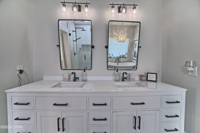 bathroom with vanity and a shower with shower door