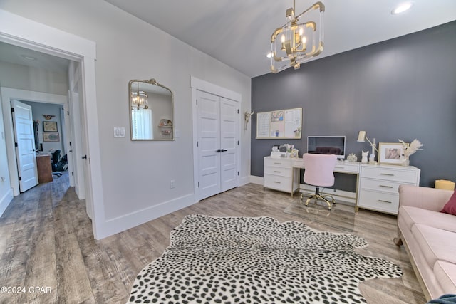 office featuring a chandelier and hardwood / wood-style flooring