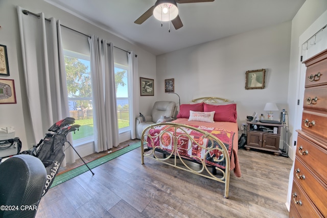 bedroom featuring light hardwood / wood-style flooring and ceiling fan